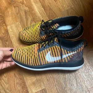 Orange nike flyknit sneakers